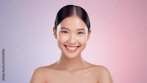 young woman smiling joyfully in soft pastel portrait sequence