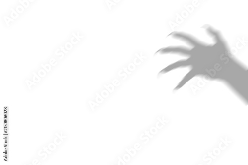Картината върху платно A dark scary shadow of a clawed monster hand reaching out from the side of the f