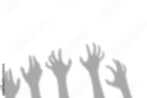 Creepy shadow of multiple human hands reaching upwards in a scary gesture presented as an isolated object on a transparent background isolated on transparent background