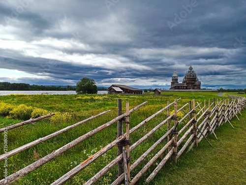 Photography A traditional wooden church with onion domes.