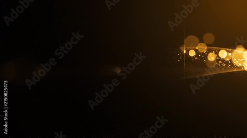 Golden sparkling particles and light wave flowing across a dark abstract background