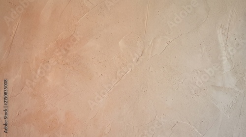 Beige Venetian plaster wall texture with subtle trowel marks and smooth stucco finish.
