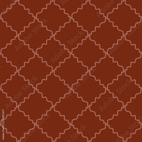 Close-up of a textured tile surface with a geometric pattern and reddish-brown color suitable for interior design and decorative backgrounds