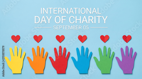 Colorful paper hand cutouts with red hearts celebrating international day of charity observance event concept