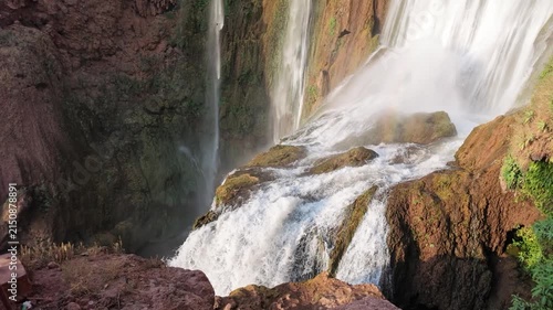 Cinematic slow motion capturing majestic water plunges and rainbows at Ouzoud