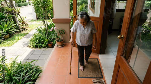 Overhead view of a tidy home entrance with non-slip mat cane and clear