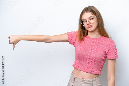 Foto Teenager Russian girl isolated on white background showing thumb down with negat