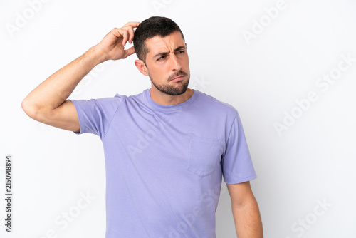 Bild auf Leinwand Young handsome caucasian man isolated on white background having doubts while sc
