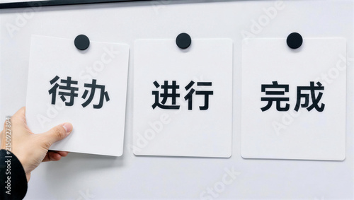 Hand Holding Task Cards in a Bright Office Environment