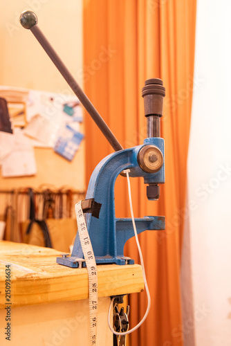 manual mechanical press, professional equipment for leatherworking in a craft workshop