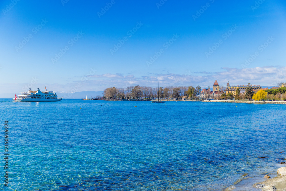 Fototapeta premium Lake Geneva shoreline with sunny Lausanne view, Switzerland