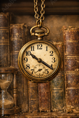 An old-fashioned clock hanging on a bookshelf, indicating the time and adding a touch of vintage charm to the room.