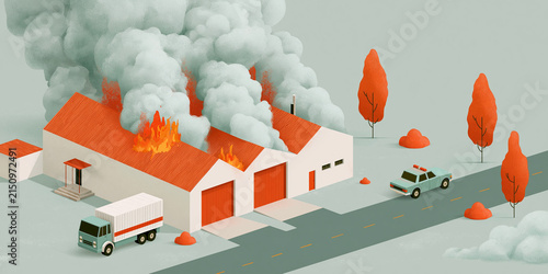 An industrial building engulfed in flames, with smoke billowing from the roof. A police car and a delivery truck are present at the scene, suggesting an emergency