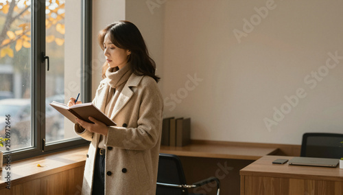 Woman Planning in Autumn Sunlight