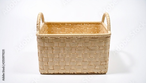 Rectangular woven basket with handles on white background