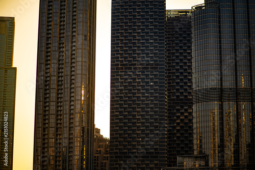 Sunset urban skyline scene on beautiful tall skyscrapers buildings in the city of Dubai, UAE