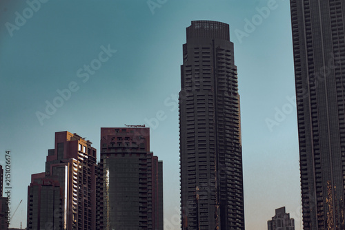 Sunset urban skyline scene on beautiful tall skyscrapers buildings in the city of Dubai, UAE