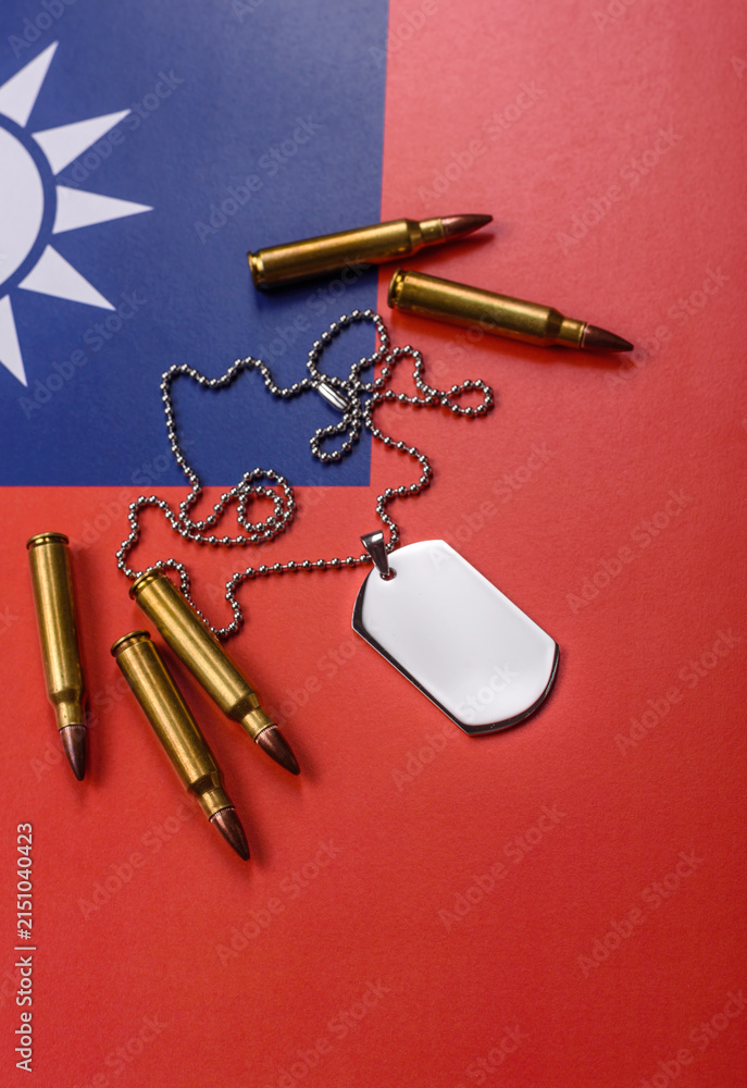 Fototapeta premium A dog tag on the taiwanese flag, serving as a conceptual backdrop representing defense