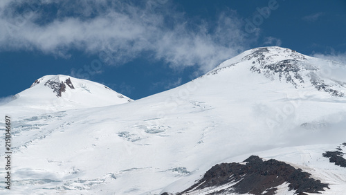 Cuadro en lienzo Snow-covered mountains Elbrus under a blue sky in summer