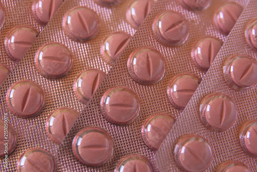 Medical tablets packed in pink blister pack