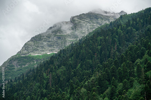 Clouds gather over mountains and forests in summer Karachay-Cherkess Republic