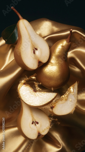 Golden Pears on Satin Fabric with Splashing Juice