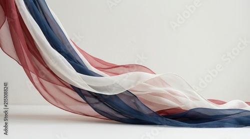 Flowing Red White and Blue Fabric on Light Background.