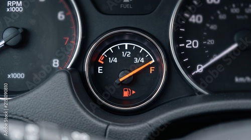 Full Fuel Gauge Closeup on Car Dashboard with Speedometer