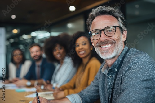 Smiling Diverse Business Team in Office Meeting Discussing Ideas