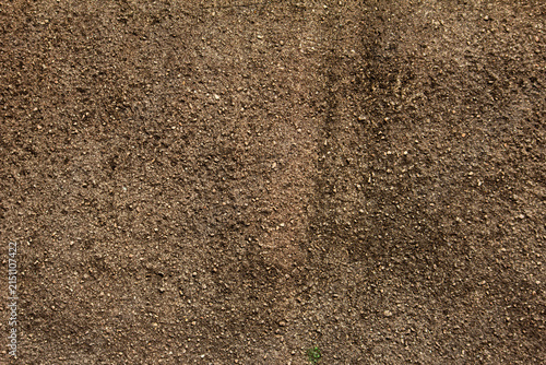 Obraz na plátne Ground covered with loose soil showing texture under natural light at a rural lo