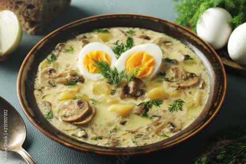 The rustic bowl with traditional Czech mushroom soup Kulajda
