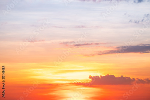 Obraz na plátně Sky sunset,Beautiful sunrise sky with vibrant gradient orange and gold colors and soft blue, Clear atmosphere with wispy clouds