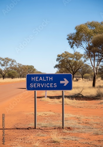 Health Services Sign Directing on Remote Australian Outback Dirt Road