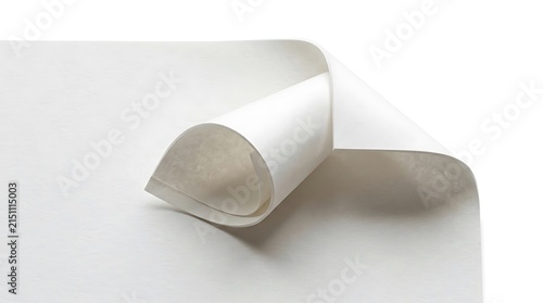 Blank white paper page corner curling up on white background.