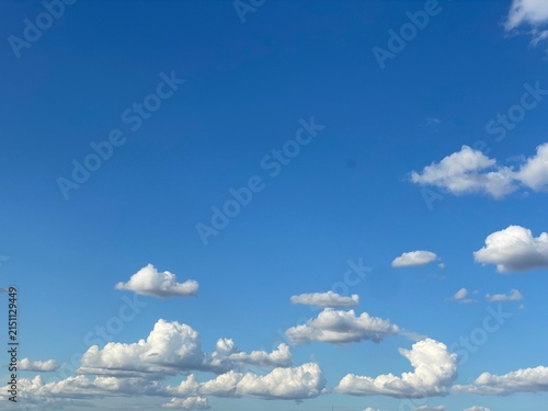 Vibrant Blue Sky Filled with Fluffy White Cumulus Clouds on a Clear Sunny Day