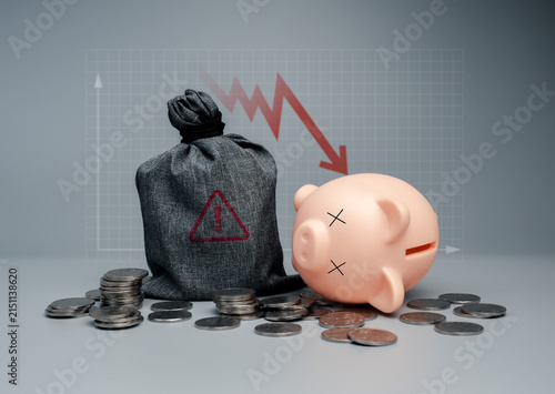 Fotografía Financial risk concept with broken piggy bank, money bag, scattered coins, and declining graph, representing personal financial crisis, bankruptcy, savings loss, economic uncertainty, wealth decline