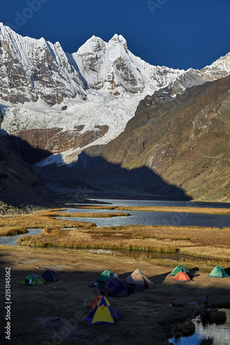 Jahuacocha Lagoon campsite, deep in Peru's Cordillera Huayhuash. this scene captures the essence of remote, high-altitude camping far from any road or town.