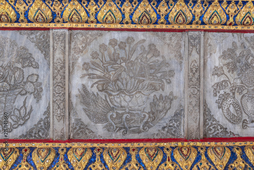 Картината върху платно Traditional Thai Temple Stone Carving with Floral Motif and Gold Ornament