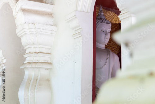 Photography White Buddha Statue Framed by Traditional Temple Archway with Soft Natural Light