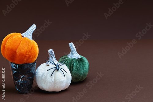 Konstfotografi Orange white and green velvet pumpkins with skull glass and spider, Halloween tr