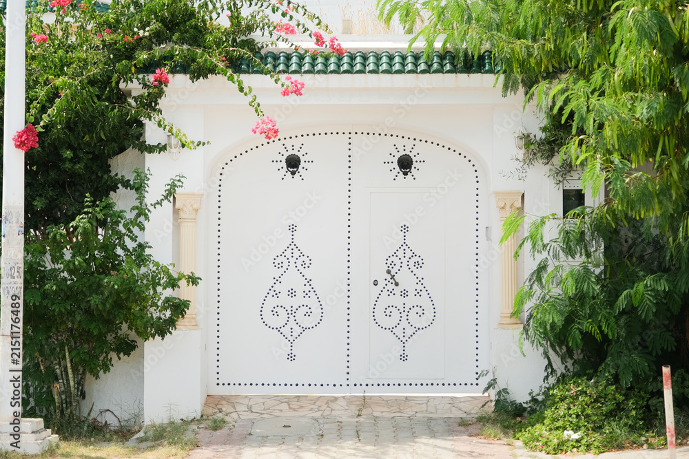 Fototapeta premium White Mediterranean building and Bougainvillea in Mediterranean Town