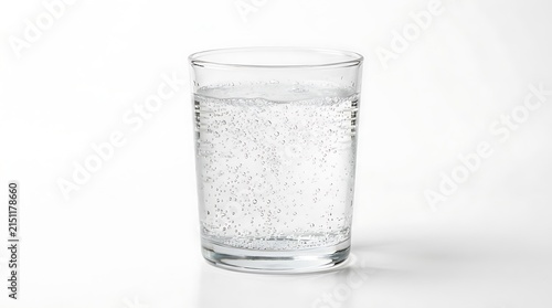 Clear glass of refreshing sparkling water with bubbles on white background.