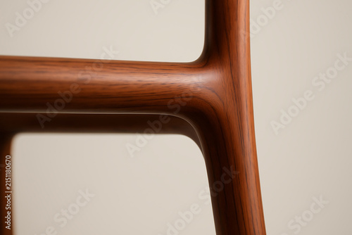 Close up of modern wooden furniture frame with smooth curves and warm natural grain