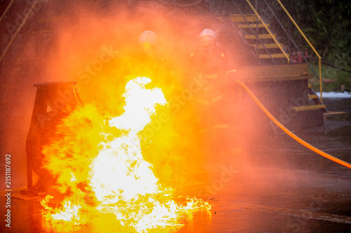 Принти на полотні Intense flames and heavy black smoke erupt from a powerful explosion outside a b