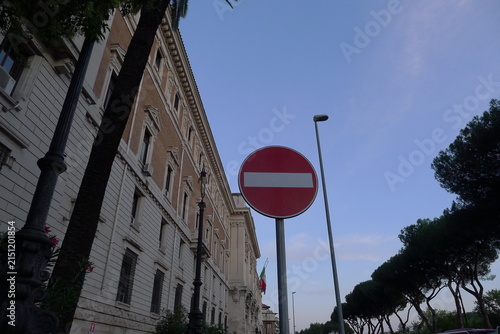 Eed No Entry Traffic Sign on Street in Front of European Classical Building