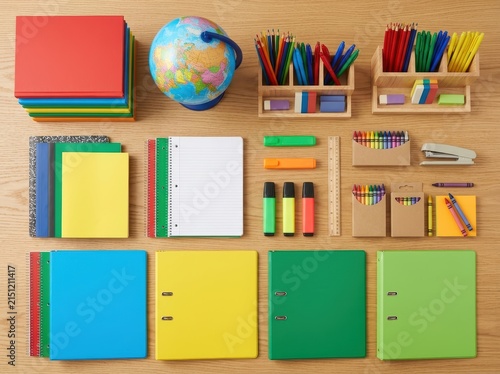 Neatly Organized School Supplies On A Wooden Desk, Ready For Learning And Creativity.