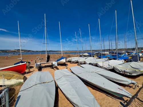 Bild auf Leinwand Small Sailboats and Dinghies Parked on Exe Estuary Beach in Exmouth, Devon