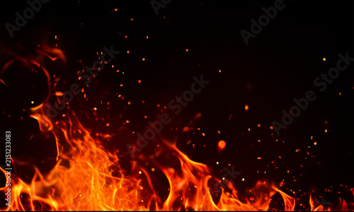 Realistic fire flames and sparks on a black background intense heat and burning embers