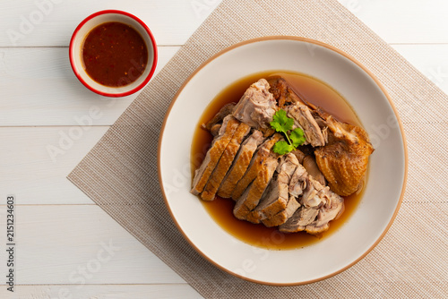 Pot Stewed Duck, Chinese Braised Duck in white plate.served with Soybean dipping sauce.(Thai ped palo)