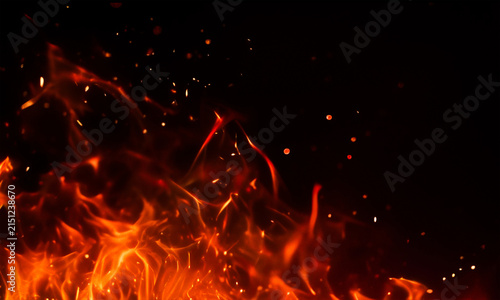 Realistic fire flames and sparks on a black background intense heat and burning embers